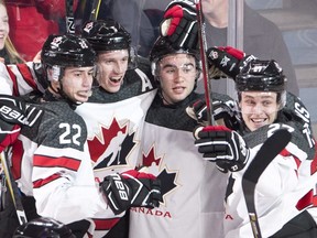 Canada defenceman Thomas Chabot (5) celebrates his goal with teammates Anthony Cirelli (22) Dillon Dube (9) and Mitchell Stephens (27) in the quarter-final of the IIHF World Junior Championships against the Czech republic on Jan. 2, 2017, in Montreal. Dube helped the Kelowna Rockets jump out to a 2-0 lead against the Kamloops Blazers in their first-round WHL playoff series. (The Canadian Press)