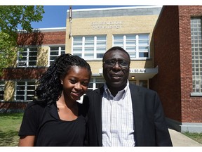 Ibrahim Karidio with his daughter Fatima in front of Ecole Gabrielle-Roy in Edmonton in 2015.