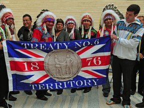 Mayor Don Iveson proclaims Treaty 6 Day while holding the Treaty 6 flag in 2014.