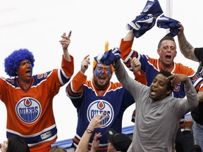 Edmonton Oilers fans cheer during the third period of the team's March 28, 2017, game against the visiting Los Angeles Kings. The Oilers won 2-1 to clinch their first NHL playoff berth in 11 years.