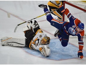 Edmonton Oilers captain Connor McDavid flies through the air after rushing Pittsburgh Penguins goalie Marc-Andre Fleury at Rogers Place in Edmonton on Saturday, March 10, 2017. (Ed Kaiser)