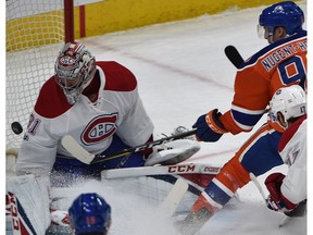 Edmonton Oilers forward Ryan Nugent-Hopkins tries to get the puck over Montreal Canadiens goalie Carey Price at Rogers Place in Edmonton on Monday, March 12, 2017. (Ed Kaiser)