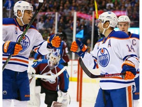 Jordan Eberle is congratulated Edmonton Oilers teammates Milan Lucic and Connor McDavid after scoring against the Colorado Avalanche at Pepsi Center on Nov. 23, 2016, in Denver. (Getty Images)