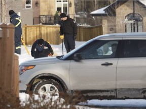 Edmonton Police Service officers investigate a shooting on Hollands Way in the Hodgson neighbourhood of Edmonton on Thursday, March 9, 2017.