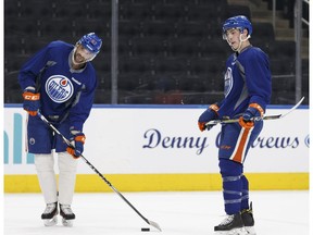 Edmonton's Benoit Pouliot (67) and Ryan Nugent-Hopkins (93) chat during an Edmonton Oilers practice at Rogers Place in Edmonton ahead of a March 10 game versus the Pittsburgh Penguins on Thursday, March 9, 2017.