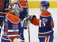 Edmonton's Connor McDavid (97) celebrates his game winning overtime goal with goaltender Cam Talbot (33) during a NHL game between the Edmonton Oilers and the Florida Panthers at Rogers Place in Edmonton, Alberta on Wednesday, January 18, 2017.