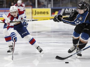 Edmonton's Davis Koch (left) battles Kootenay's Brett Davis during a WHL game between the Edmonton Oil Kings and the Kootenay Ice at Rogers Place in Edmonton on March 1, 2017.