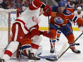 Edmonton's Eric Gryba (62) battles Detroit's Anthony Mantha (39) during the first period of a NHL game between the Edmonton Oilers and the Detroit Red Wings at Rogers Place in Edmonton on Saturday, March 4, 2017.