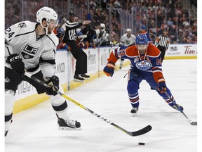 Edmonton's Jordan Eberle (14) battles LA's Derek Forbort (24) during the second period of a NHL game between the Edmonton Oilers and the LA Kings at Rogers Place in Edmonton on Tuesday, March 28, 2017.