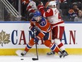 Edmonton's Oscar Klefbom (77) battles Detroit's Henrik Zetterberg (40) during the first period of a NHL game between the Edmonton Oilers and the Detroit Red Wings at Rogers Place in Edmonton on Saturday, March 4, 2017.