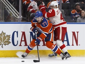 Adam Larsson #6 and Oscar Klefbom #77 of the Edmonton Oilers defend against Garnet Hathaway of the Calgary Flames on Sept. 26, 2016, at Rogers Place. (Getty Images)