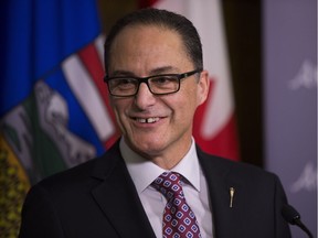 Finance Minister Joe Ceci talks to the media before reading the budget in the Alberta Legislature on Thursday March 16, 2017 in Edmonton.