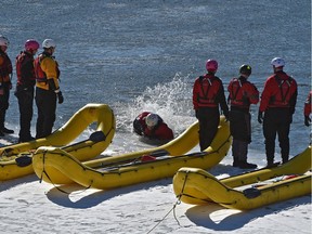 Firefighters participate in their annual swift water ice training on the North Saskatchewan River in Rundle Park on March 3, 2017.