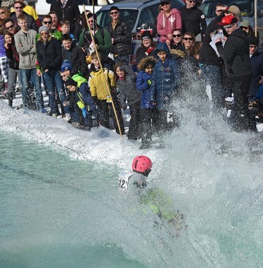 Hunter Lebb sprays a whole bunch of spectators during the annual Slush Cup festival at the Edmonton Ski Club on Saturday, March 18, 2017.