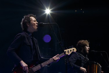 Bassist Byron Isaacs (left) and accordion player and percussionist Stelth Ulvang of The Lumineers perform with the band at Rogers Place in Edmonton on Friday, March 31, 2017. Ian Kucerak / Postmedia