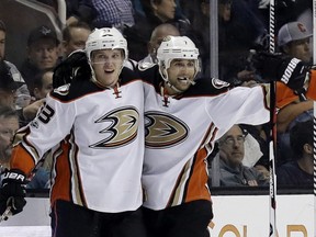 Anaheim Ducks' Jakob Silfverberg, center left, celebrates his goal with teammates Andrew Cogliano, center right, during the second period of an NHL hockey game against the San Jose Sharks Saturday, March 18, 2017, in San Jose, Calif.