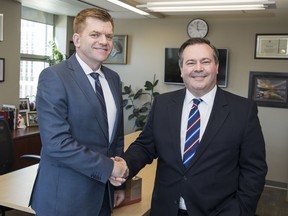 Wildrose Leader Brian Jean meets with newly elected PC Leader Jason Kenney as they announce plans for new discussion groups for conservative unity on March 20, 2017.