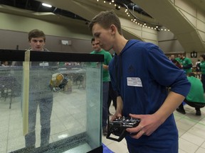 Gr. 12 student Joel Patterson maneuvers his team's powered submarine in a timed competition at the APEGA Science Olympics.