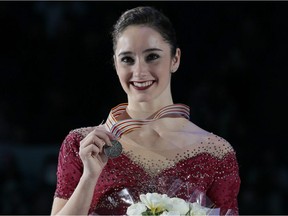 Kaetlyn Osmond, of Canada, smiles holding her silver medal during victory ceremony at the World figure skating championships in Helsinki, Finland, on Friday, March 31, 2017.