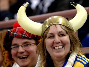 Curling fans Marj Westergard, right, and son Rhyan cheer on Team Sweden at the Ford World championships in Edmonton on April 5, 2007. (Ed Kaiser)