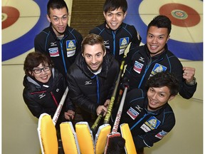 National coach J.D. Lind (centre) has been working with Team Japan, from left, team coach Hatomi Nagaoka, third Tetsuro Shimizu, skip Yusuke Morozumi, second Tsuyoshi Yamaguchi and lead Kosuke Morozumi, for the upcoming Men's World Curling championships in Edmonton. (Ed Kaiser)