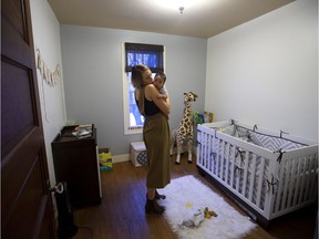 Julia Lipscombe and her son Indiana Lipscombe in their Edmonton home on Thursday, Feb. 2, 2017.