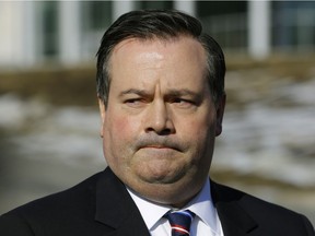Newly elected Alberta Progressive Conservative party Leader Jason Kenney speaks with news media outside the Federal Building in Edmonton on Monday March 20.