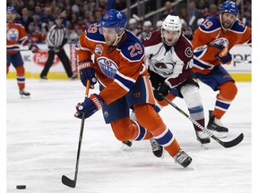 The Edmonton Oilers' Leon Draisaitl battles the Colorado Avalanche's Sven Andrighetto at Rogers Place in Edmonton on Saturday, March 25, 2017. (David Bloom)