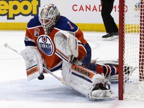 Edmonton Oilers goaltender Laurent Brossoit makes a save during third-period NHL action against the Colorado Avalanche at Edmonton's Rogers Place on March 25, 2017.