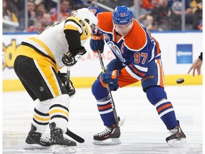 EDMONTON, AB - MARCH 10:  Connor McDavid #97 of the Edmonton Oilers faces off against Sidney Crosby #87 of the Pittsburgh Penguins on March 10, 2017 at Rogers Place in Edmonton, Alberta, Canada.
