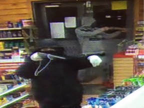 Police have released this photo of two male suspects wanted after a gas station in Maskwacis was robbed at gunpoint on Wednesday, March  15, 2017.