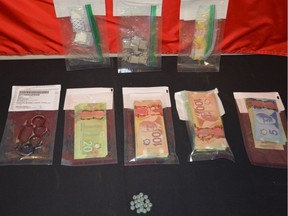 Police seized 23 fentanyl pills, a quantity of cocaine and more than $10,000 in cash during a traffic stop in the parking lot of a convenience store in the Cobblestone Plaza in Grand Prairie on March 9, 2017.