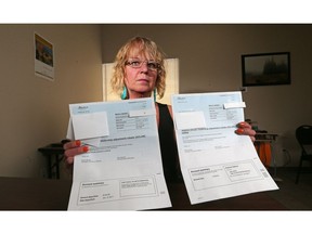 Darlene Piche holds the carbon tax rebate her mom received along with the bill for it's return after she passed away this past January. At least three Alberta families say they've been issued bills from the province to return carbon tax rebates after loved ones died.