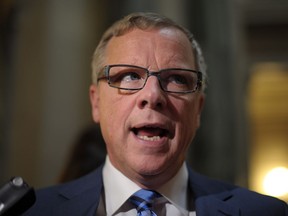 Premier Brad Wall speaks with members of the media following the 2017 budget speech at the Legislative Building in Regina Wednesday, March 22, 2017.