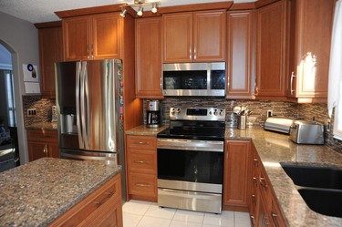 Bernadette and Bill Scott got the modern kitchen they dreamed of at a lower cost thanks to Reface Magic.