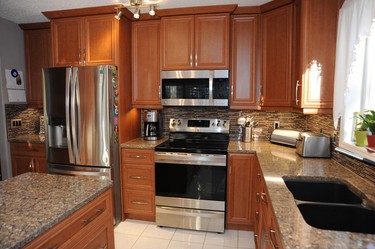 After: Cabinets can be modified to gain new space or to accommodate new appliances, such as this new and larger fridge.