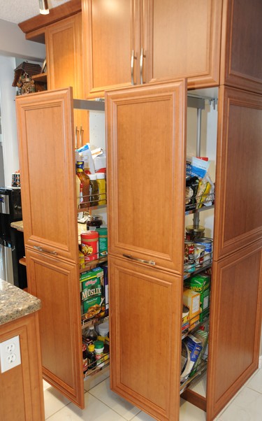 After: Converted French-style door cupboards to easy-access storage and pot drawers.