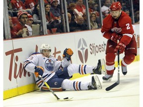 Edmonton Oilers center Ryan Nugent-Hopkins (93) moves the puck away from Detroit Red Wings defenseman Brendan Smith (2) during the third period of an NHL hockey game in Detroit, Sunday, Nov. 6, 2016. The Oilers defeated the Red Wings 2-1. The Oilers host the Red Wings on Saturday at Rogers Place.