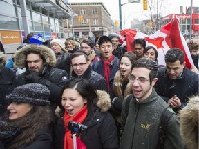 A multicultural group of Torontonians sing O Canada to end off a rally against anti-Semitism outside Toronto's Miles Nadal Jewish Community Centre on Monday March 13, 2017.  The centre was recently evacuated after a bomb threat.