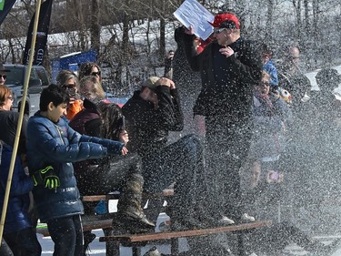 Some fans get sprayed by a skier during the annual Slush Cup festival at the Edmonton Ski Club on Saturday, March 18, 2017.