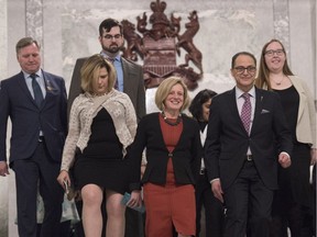 Alberta Premier Rachel Notley is flanked by Alberta Finance Minister Joe Ceci as they leave the legislative chamber and walk down the stairs to the rotunda on March 16, 2017.