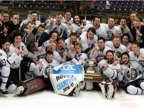 The MacEwan University Griffins men's hockey team poses with the 2016-17 ACAC championship banner following a 4-3 overtim win over the NAIT Ooks in Edmonton on Sunday, March 19, 2017. MacEwan also won the ACAC title in women's hockey this season. It was the men's first championship since 2004. (Len Joudrey/MacEwan Athletics)