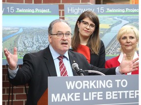 Transportation Minister Brian Mason in Fort Saskatchewan Thursday morning with Fort Saskatchewan-Vegreville MLA Jessica Littlewood and Fort Saskatchewan Mayor Gayle Katchur (right) to officially announce the twinning of the Highway 15 bridge.