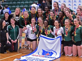University of Alberta Pandas pose with the trophy after defeating the UBC Thunderbirds in the gold medal game during the Canada West Women's Final Four volleyball tournament at the Saville Centre in Edmonton, Saturday, March 11, 2017.