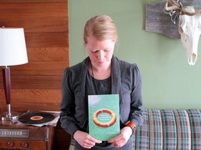 Edmonton author Lisa Martin and her new poetry book, Believing Iis Not the Same Thing as Being Saved.