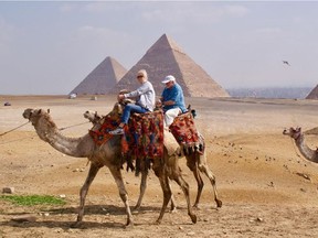 University of Alberta graduate Nancy Taubner and The Journal's Nick Lees try riding camels in the Sahara on a trip to Ancient Egypt with the U of A's Alumni Association.