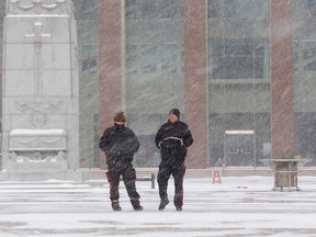 Police officers brave the snow in Churchill Square on Saturday March 4, 2017.