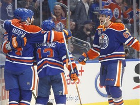 Edmonton Oilers' Zack Kassian (44), David Desharnais (13) and Benoit Pouliot (67) celebrate a goal against the Dallas Stars during second period NHL action in Edmonton, Alta., on Tuesday, March 14, 2017.