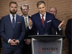 Maxime Bernier, leadership candidate for the Conservative Party of Canada, receives the endorsement of nine members of the Alberta Legislative Assembly, during a news conference at the Matrix Hotel, 10640 100 Ave., in Edmonton Tuesday, April 11, 2017.