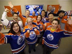 Employees at Psychometrics cheer on the Edmonton Oilers, on Tuesday April 11, 2017. Psychometrics' has challenged CPP, Inc. (based in the San Jose area) to a wager. The president in the losing team's city must wear a jersey of the winning team, and make a contribution to a local charity while in the winning team's colours.